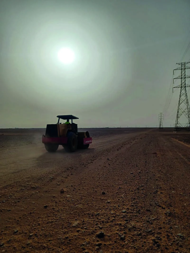 Road roller compacting site
