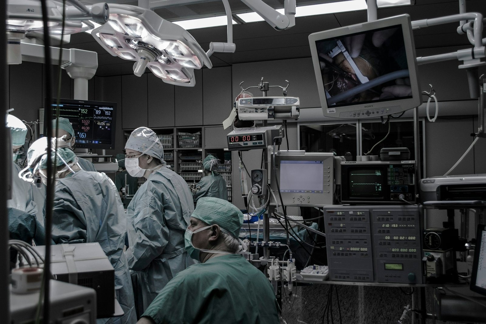 Clinical team working with monitoring equipment in an operating theatre