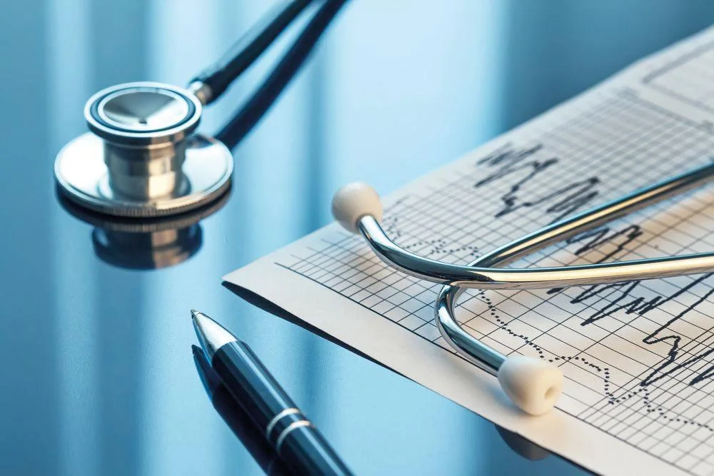 Clinical documentation and a stethoscope prepared for review